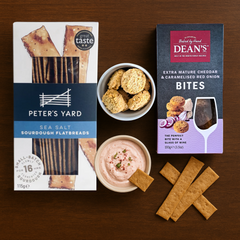 Flat lay of Peter’s Yard sea salt flatbread and Dean’s mature cheddar & caramelised onion bites
