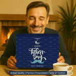 Dad holding the wrapped Father’s Day hamper box