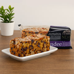 Rich Scottish Dundee fruit cake topped with flaked almonds ready for gifting